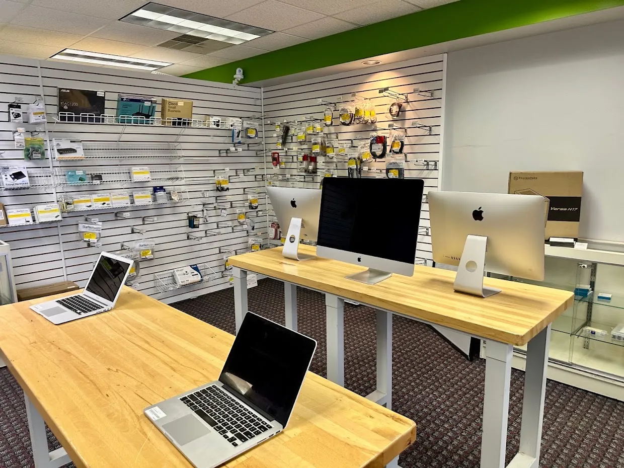 Mac repair bench with iMacs and MacBooks at Computer Doctor of Maine